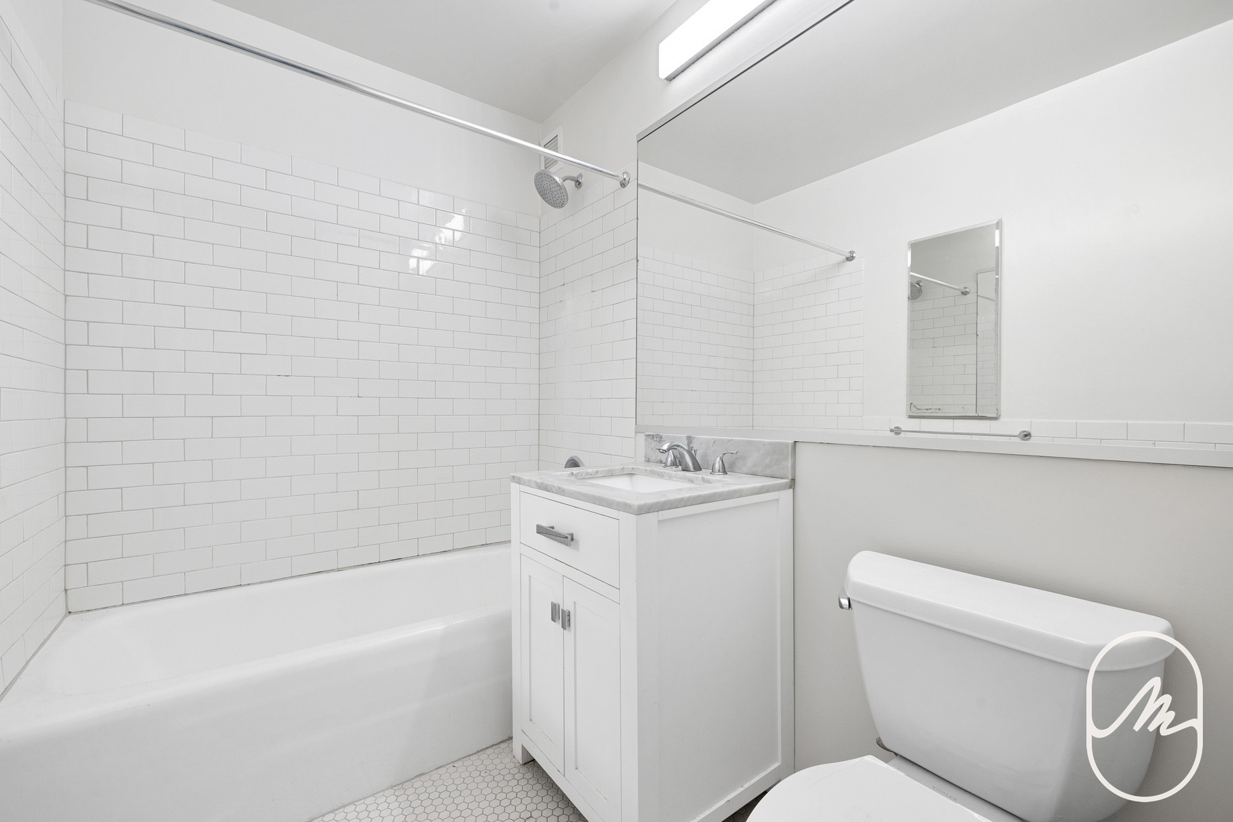 15 Park Row, Unit 3M Manhattan, NY 10038 - Photo 4 of 10 a bathroom with a sink a toilet and bathtub