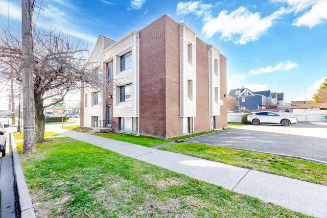a view of a building with backyard