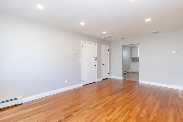 a kitchen with a sink window and cabinets