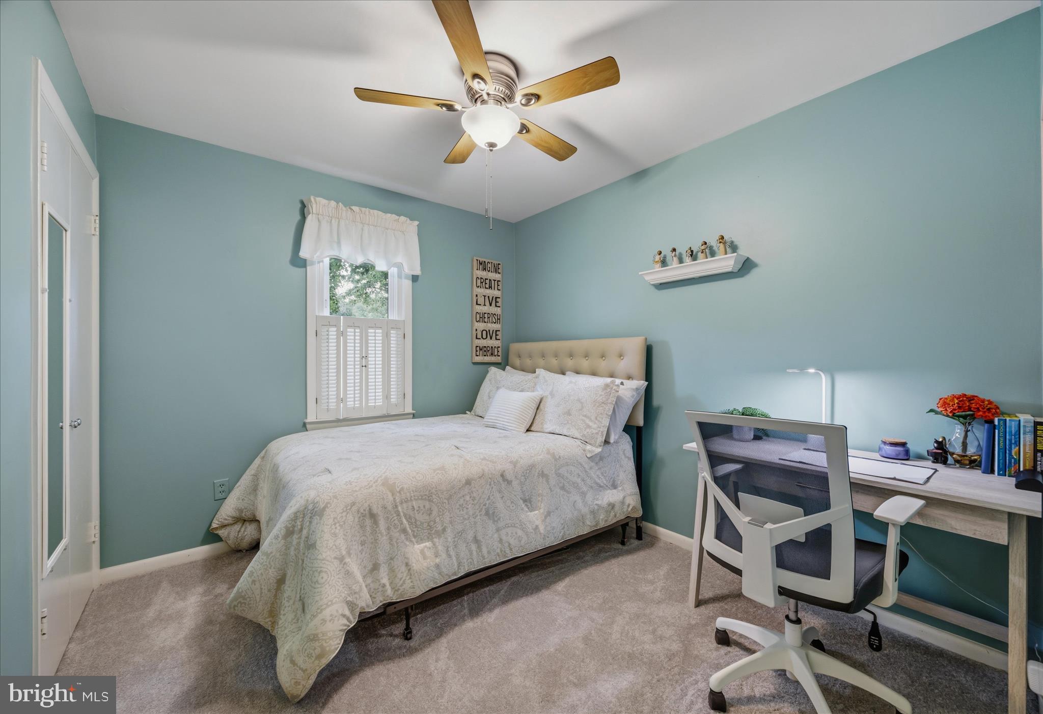 3204 Llewellyn Field Road Olney, MD 20832 - Photo 16 of 42 a bedroom with a bed and a chandelier