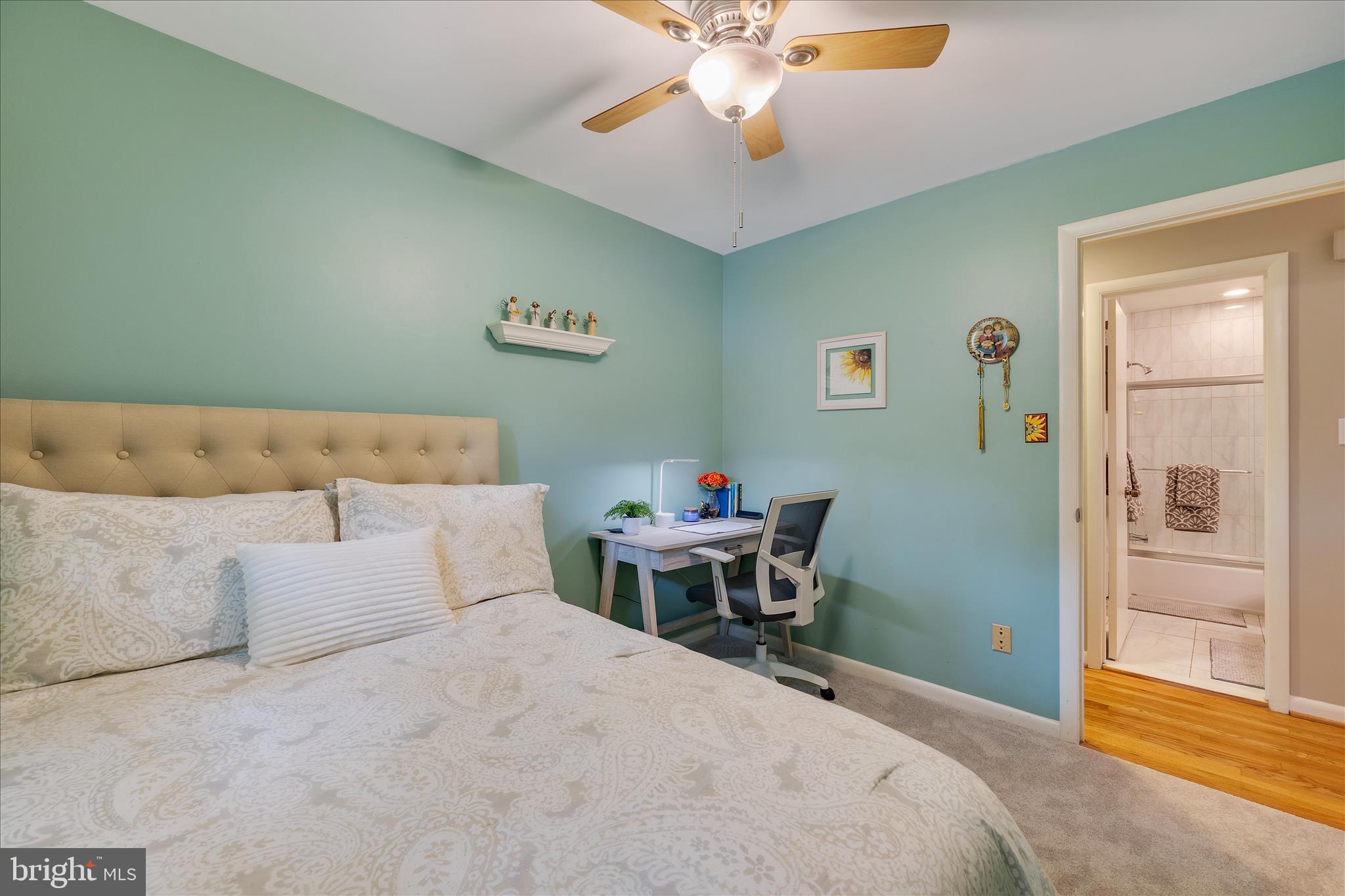3204 Llewellyn Field Road Olney, MD 20832 - Photo 17 of 42 a bedroom with a bed and a chandelier