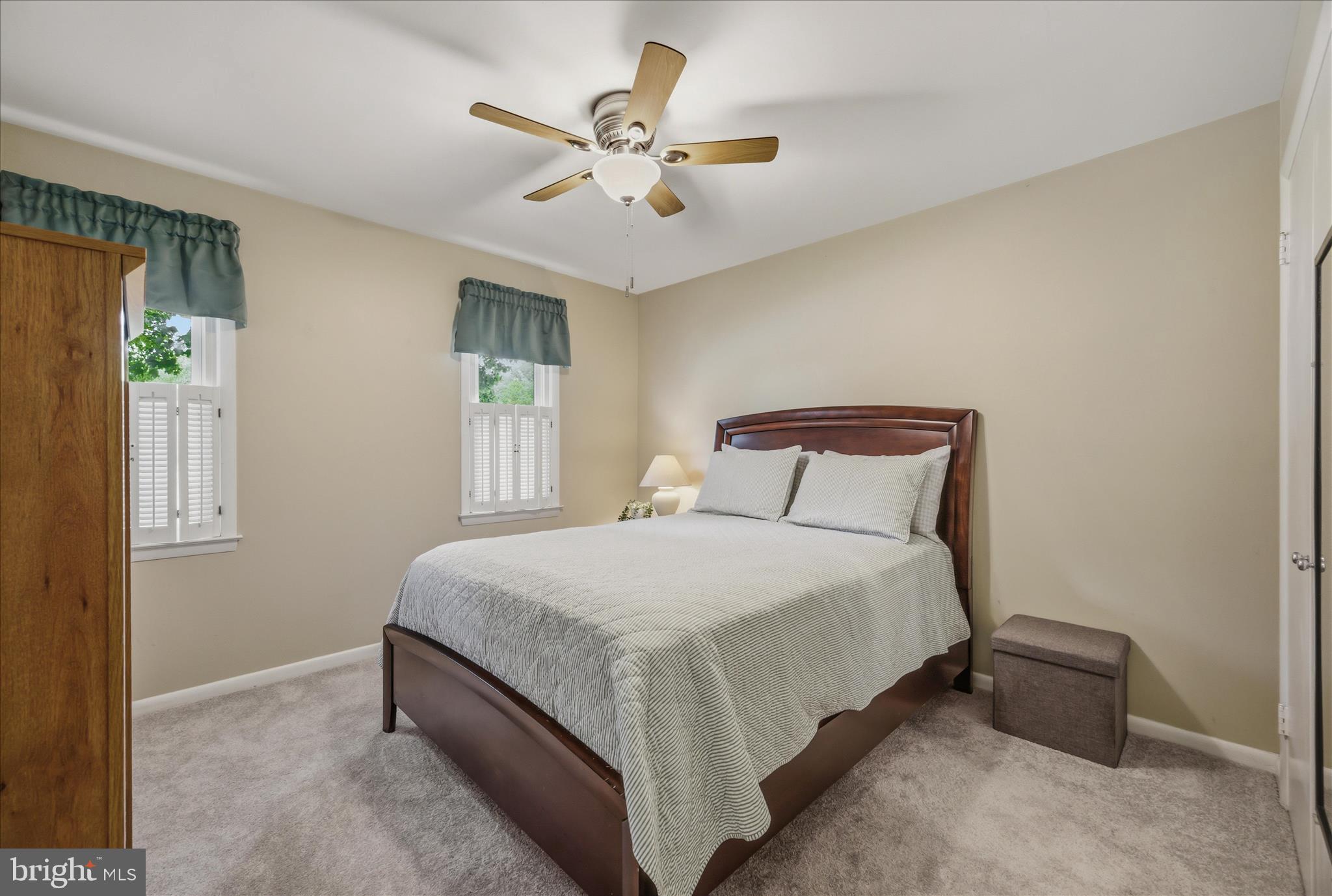3204 Llewellyn Field Road Olney, MD 20832 - Photo 18 of 42 a large bed sitting in a bedroom next to a window and a chandelier