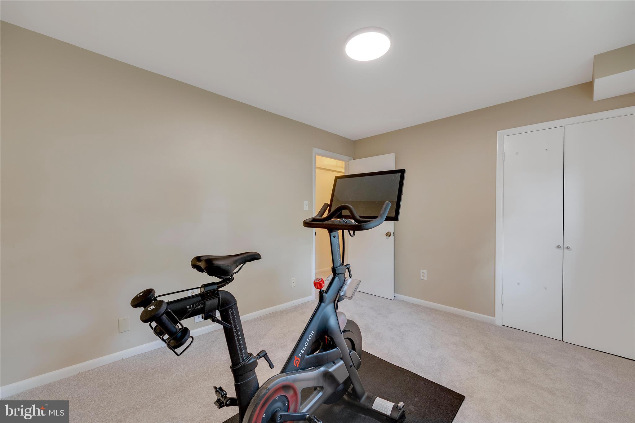 3204 Llewellyn Field Road Olney, MD 20832 - Photo 29 of 42 a room with gym equipment and windows