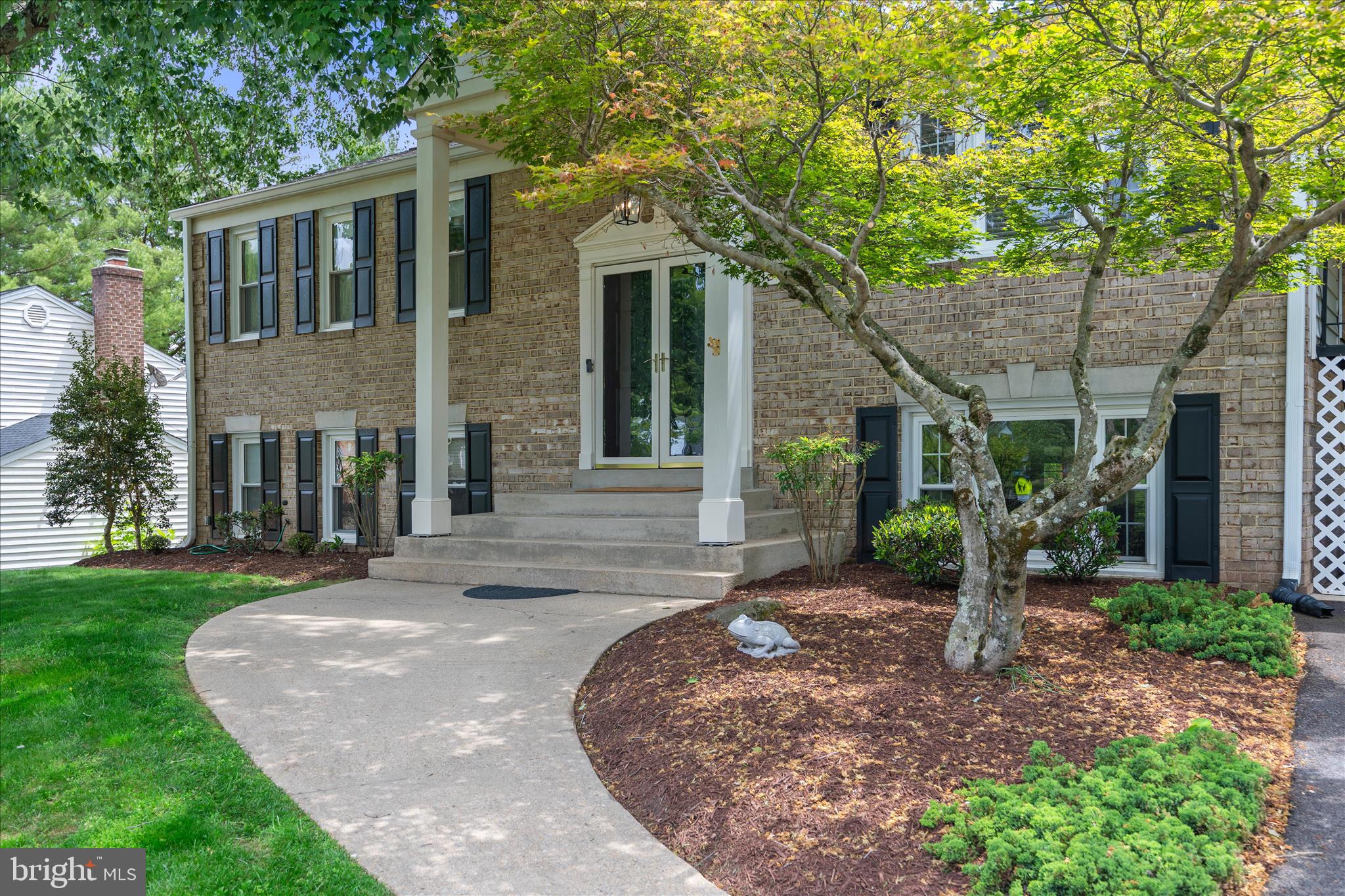 3204 Llewellyn Field Road Olney, MD 20832 - Photo 4 of 42 a front view of a house with garden and porch