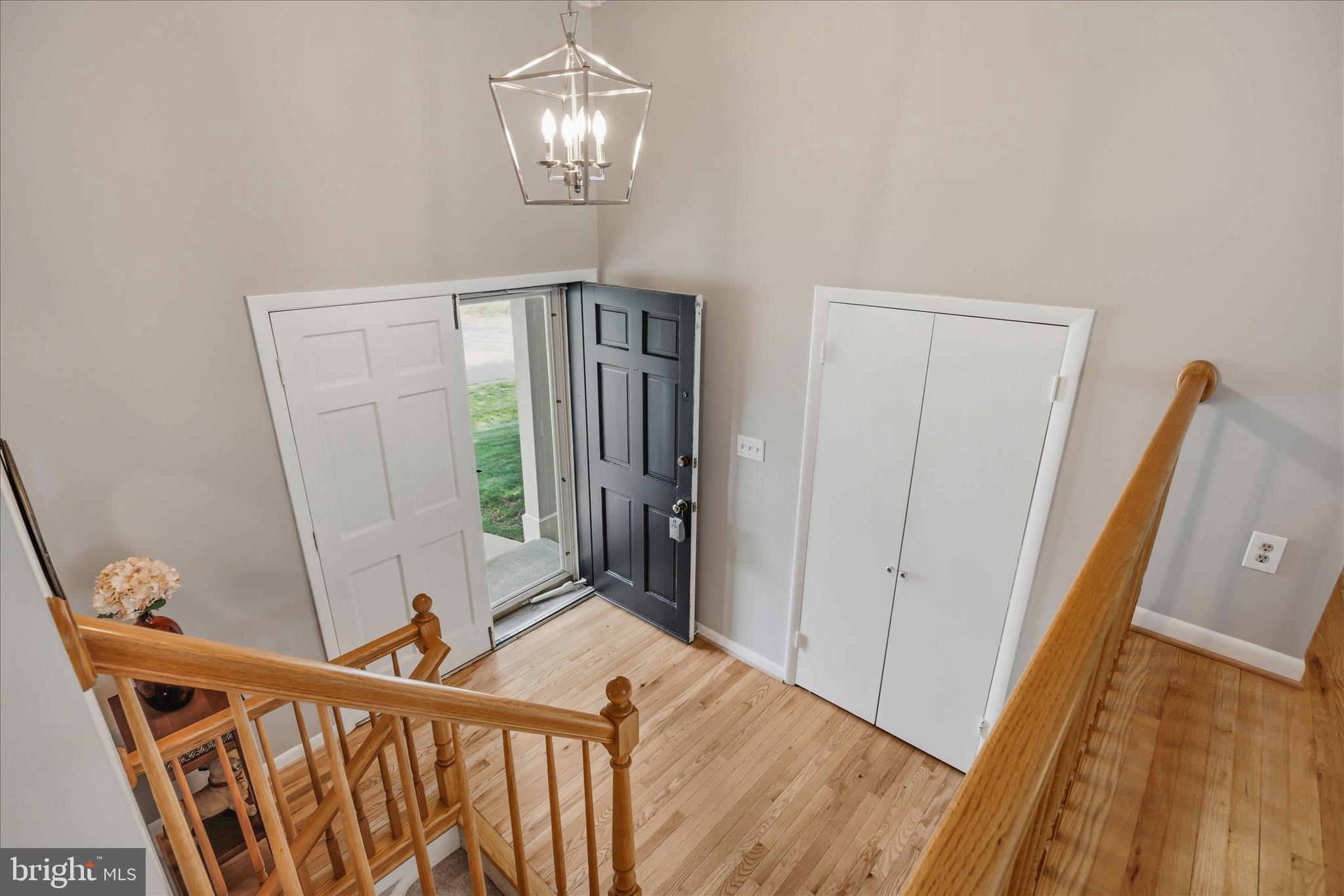 3204 Llewellyn Field Road Olney, MD 20832 - Photo 5 of 42 a view of a hallway view with wooden floor and staircase