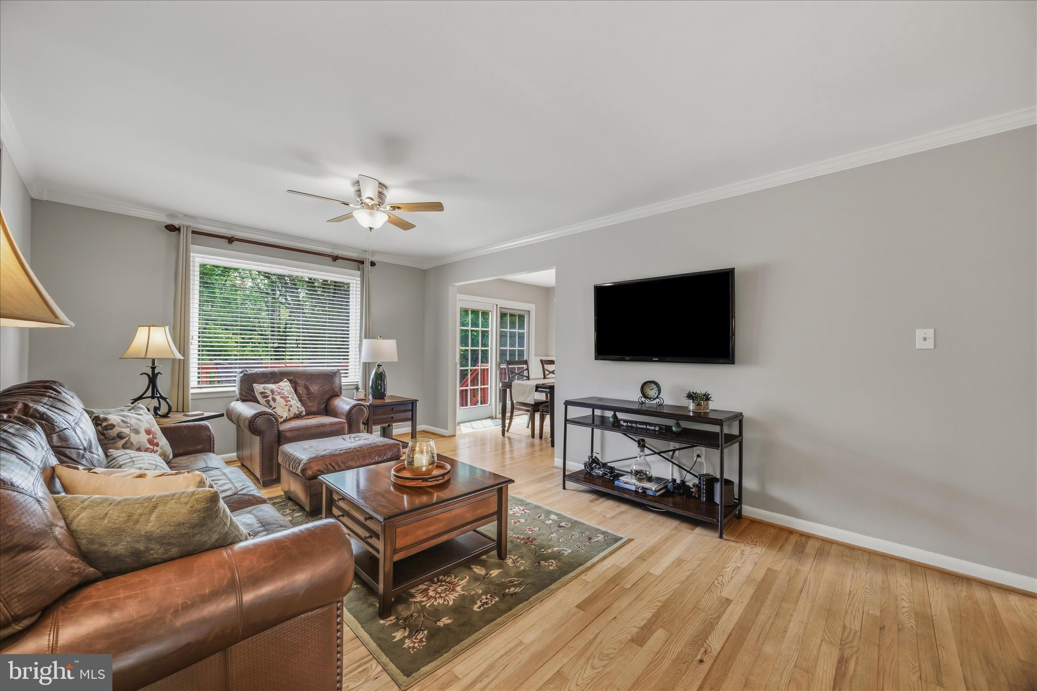 3204 Llewellyn Field Road Olney, MD 20832 - Photo 7 of 42 a living room with furniture and a flat screen tv