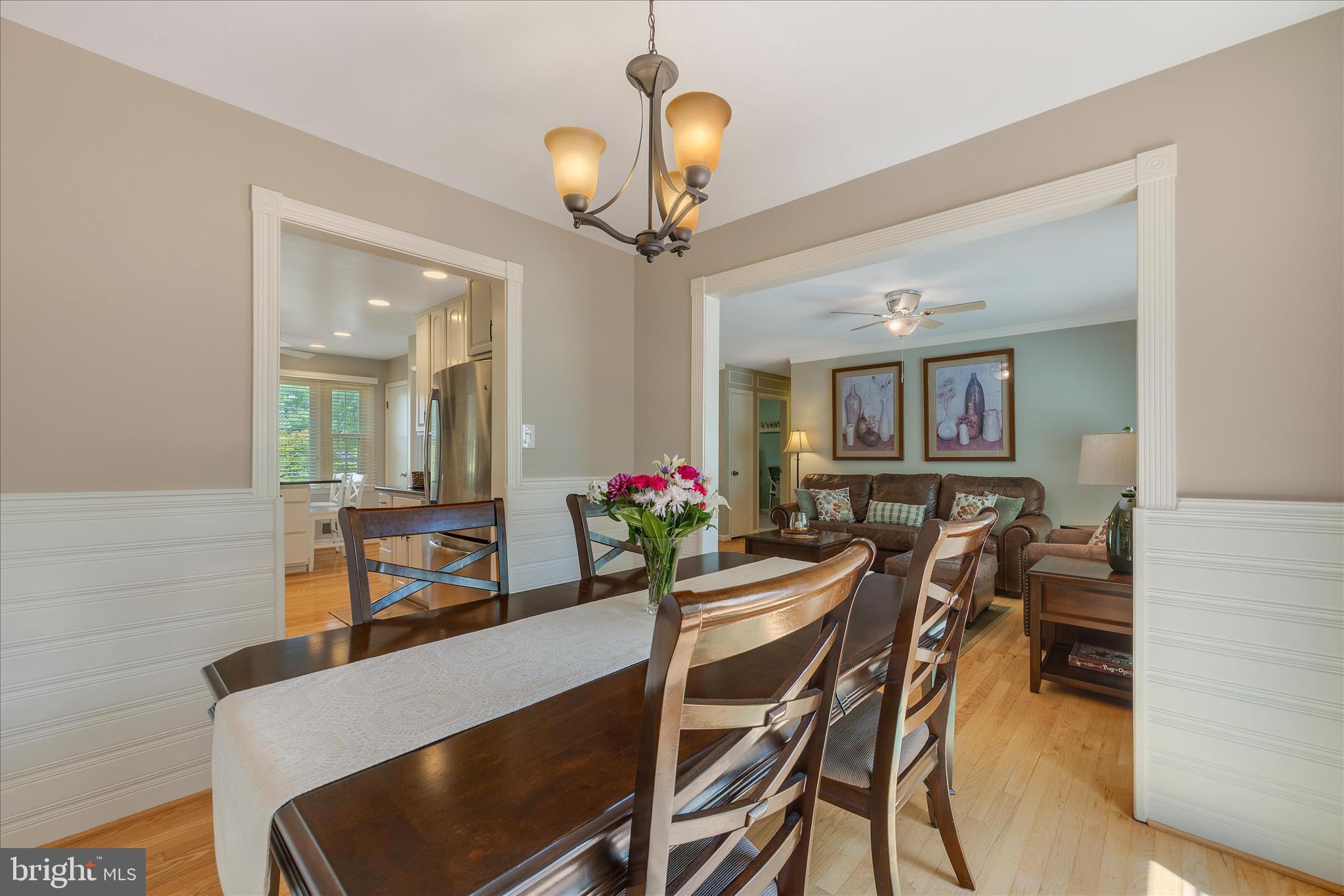 3204 Llewellyn Field Road Olney, MD 20832 - Photo 10 of 42 a view of a dining room with furniture and a chandelier
