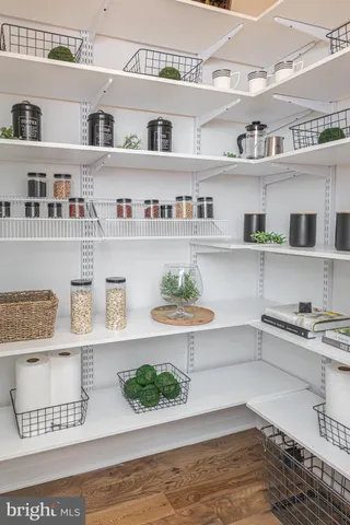 a kitchen with stainless steel appliances a sink a stove a refrigerator and cabinets