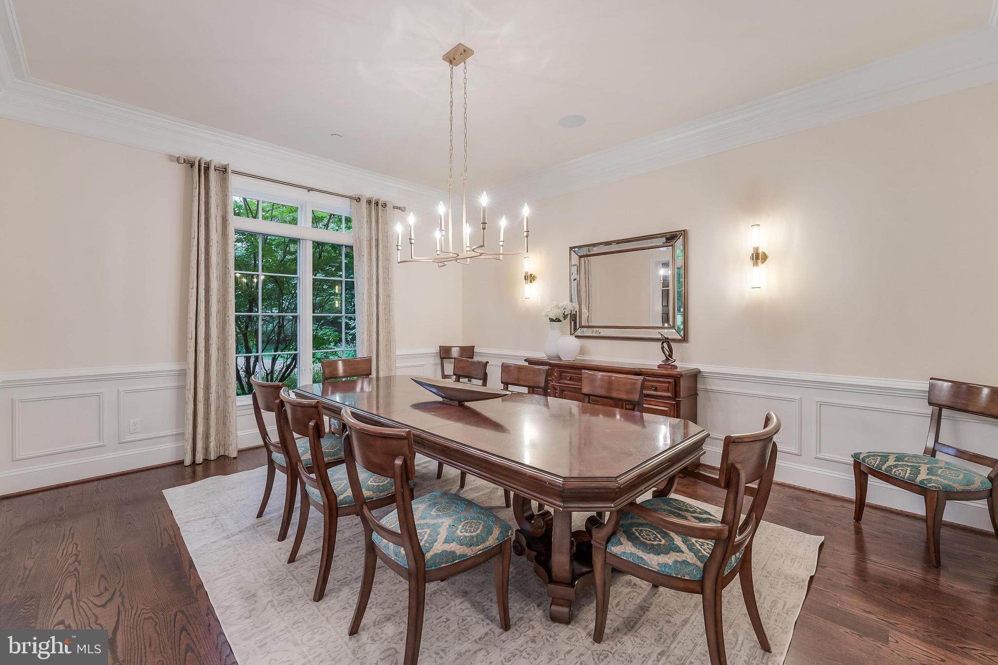 7020 Mountain Gate Drive Bethesda, MD 20817 - Photo 15 of 42 a dining room with furniture a chandelier and wooden floor