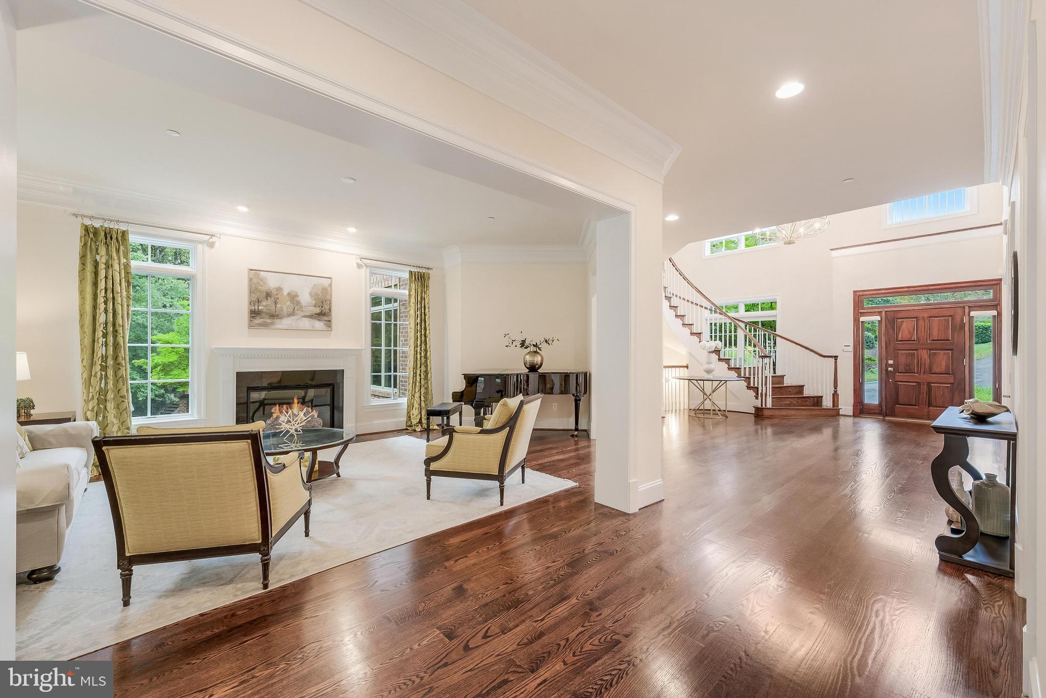 7020 Mountain Gate Drive Bethesda, MD 20817 - Photo 16 of 42 a living room with furniture and a fireplace