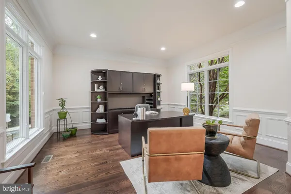 a living room with furniture a window and a dining table