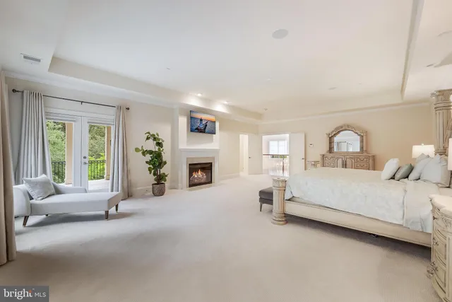 a bed room with furniture and a fireplace