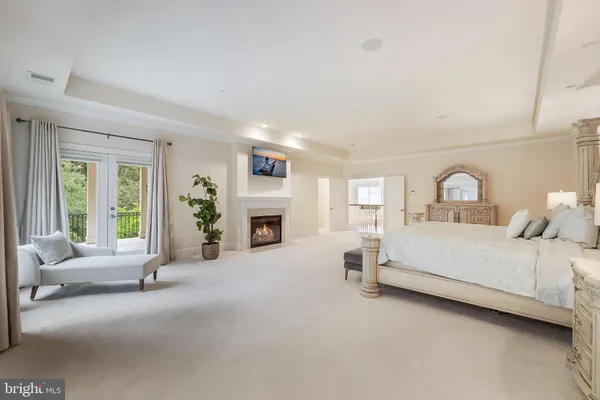 a bed room with furniture and a fireplace