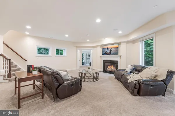 a living room with furniture window and a fireplace