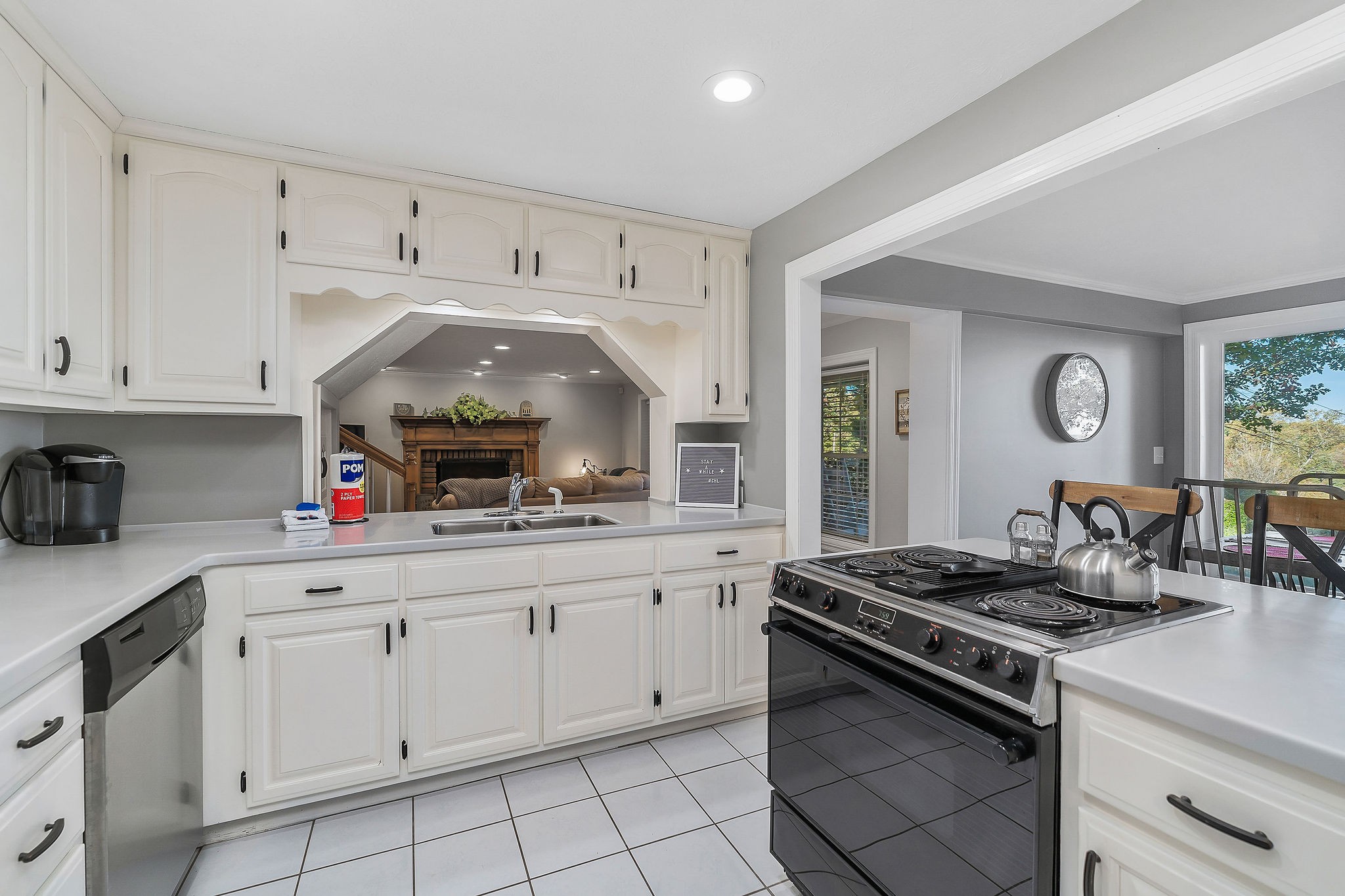 1824 Puckett Point Road Smithville, TN 37166 - Photo 17 of 53 a kitchen with white cabinets and appliances