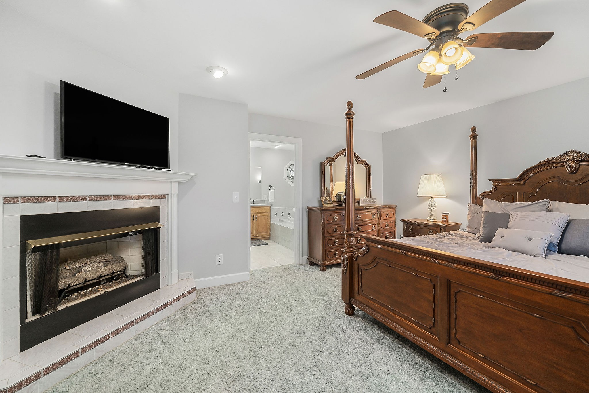1824 Puckett Point Road Smithville, TN 37166 - Photo 26 of 53 a living room with furniture a fireplace and a flat screen tv