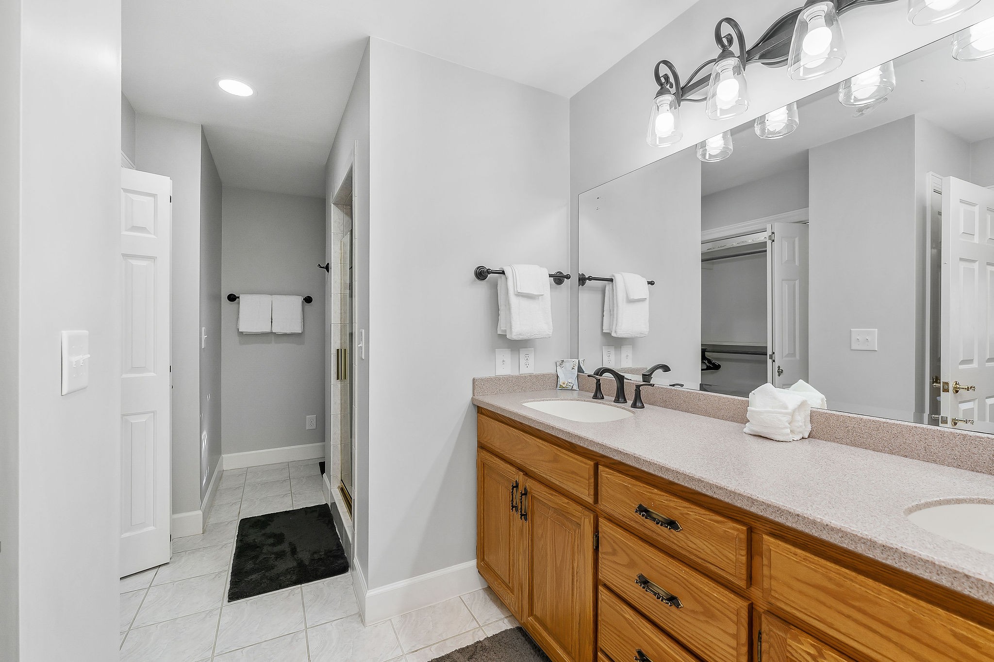 1824 Puckett Point Road Smithville, TN 37166 - Photo 30 of 53 a spacious bathroom with a granite countertop sink a mirror and shower