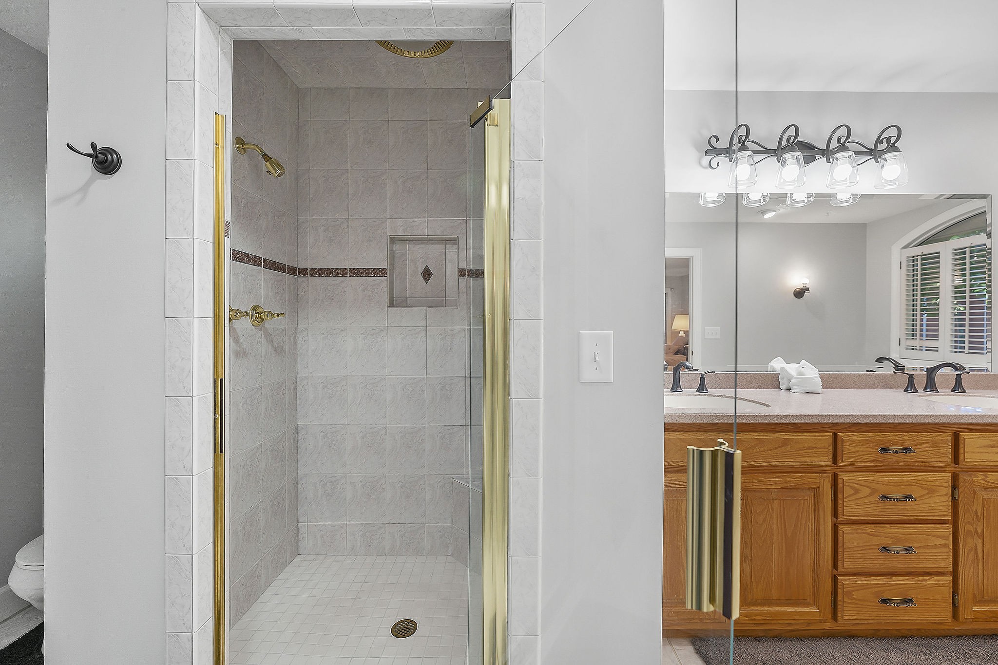 1824 Puckett Point Road Smithville, TN 37166 - Photo 31 of 53 a bathroom with a double vanity sink mirror and shower