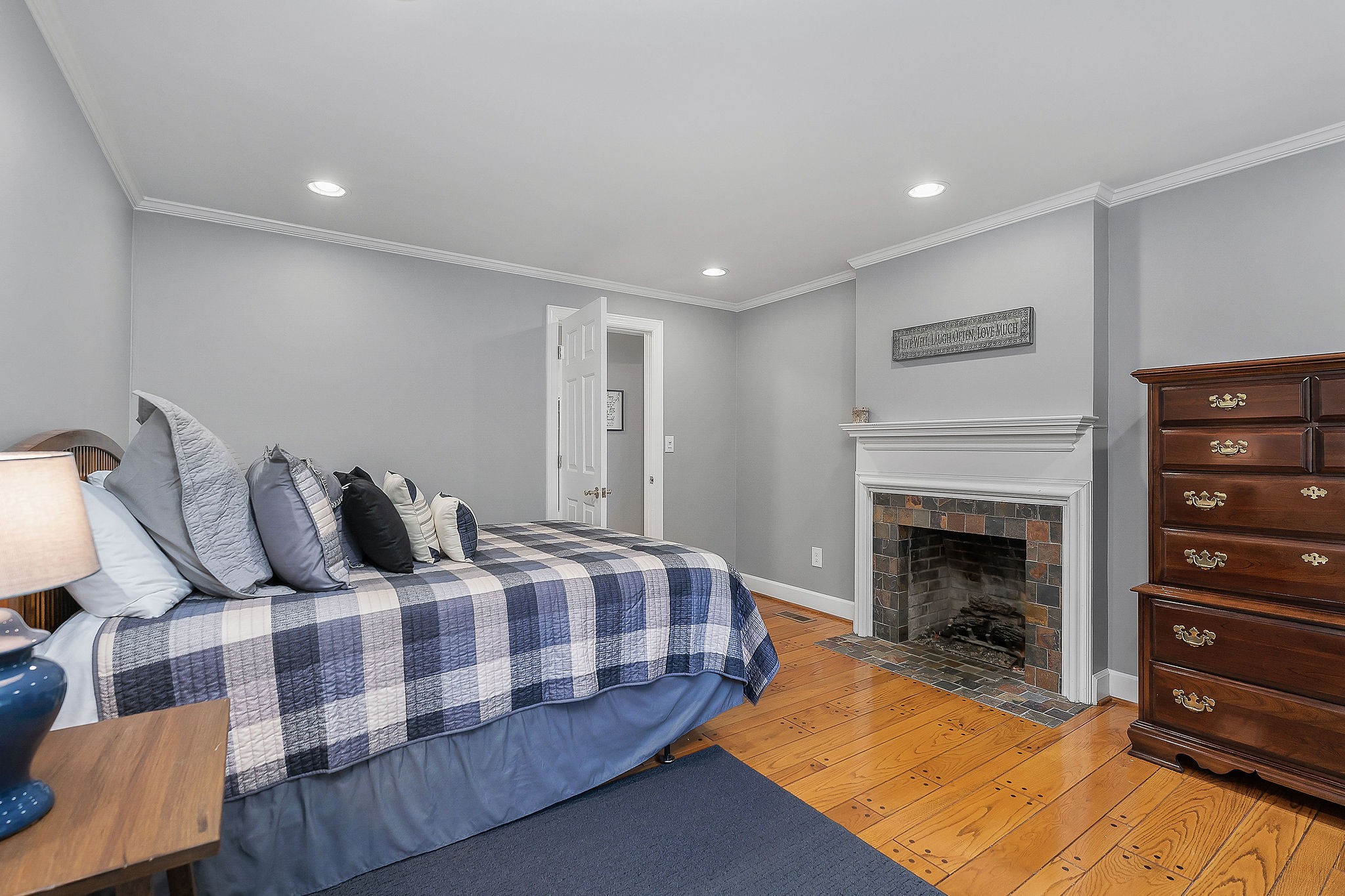 1824 Puckett Point Road Smithville, TN 37166 - Photo 33 of 53 a bedroom with bed and a fireplace