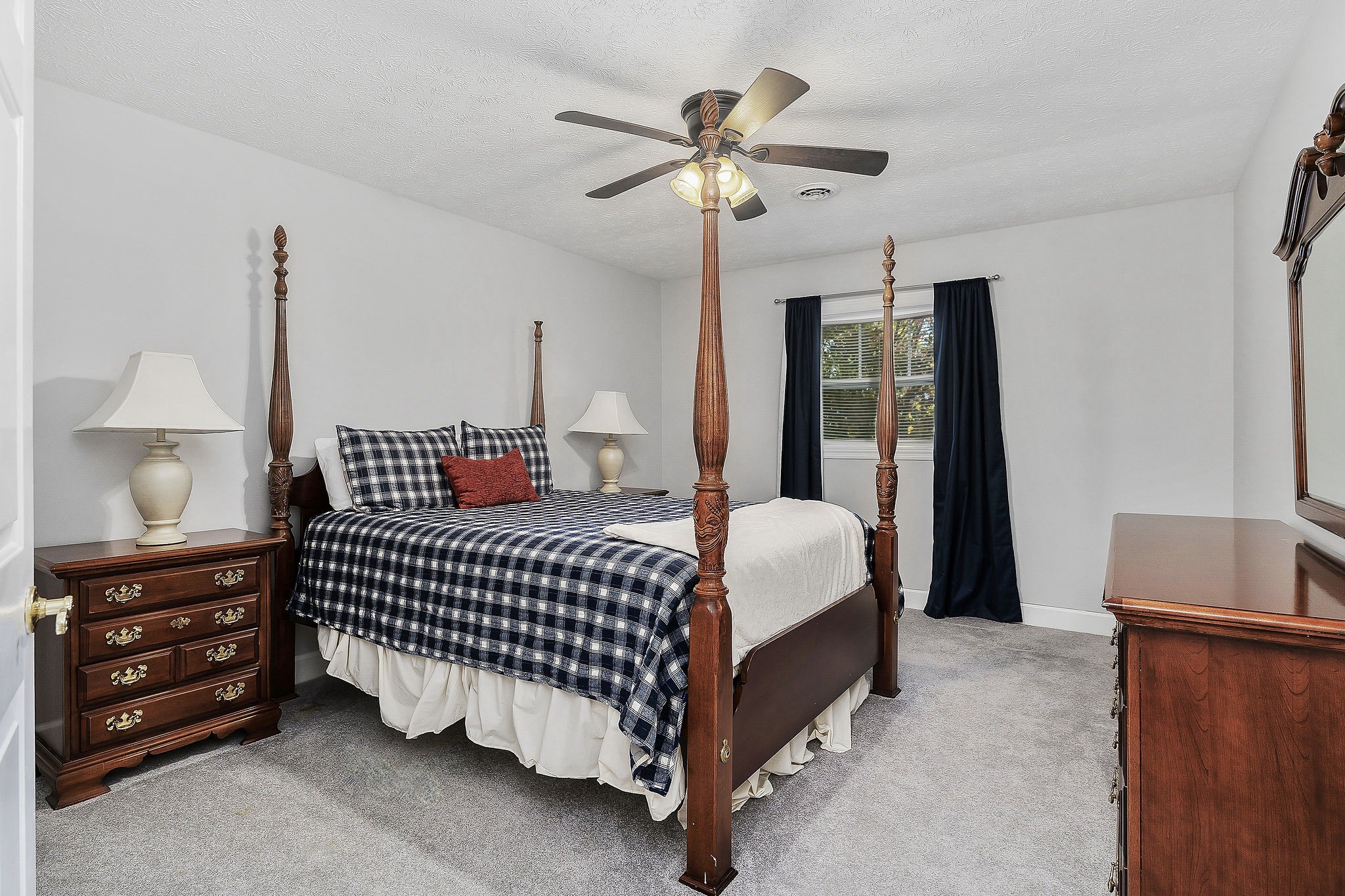 1824 Puckett Point Road Smithville, TN 37166 - Photo 43 of 53 a bedroom with a bed and a chandelier