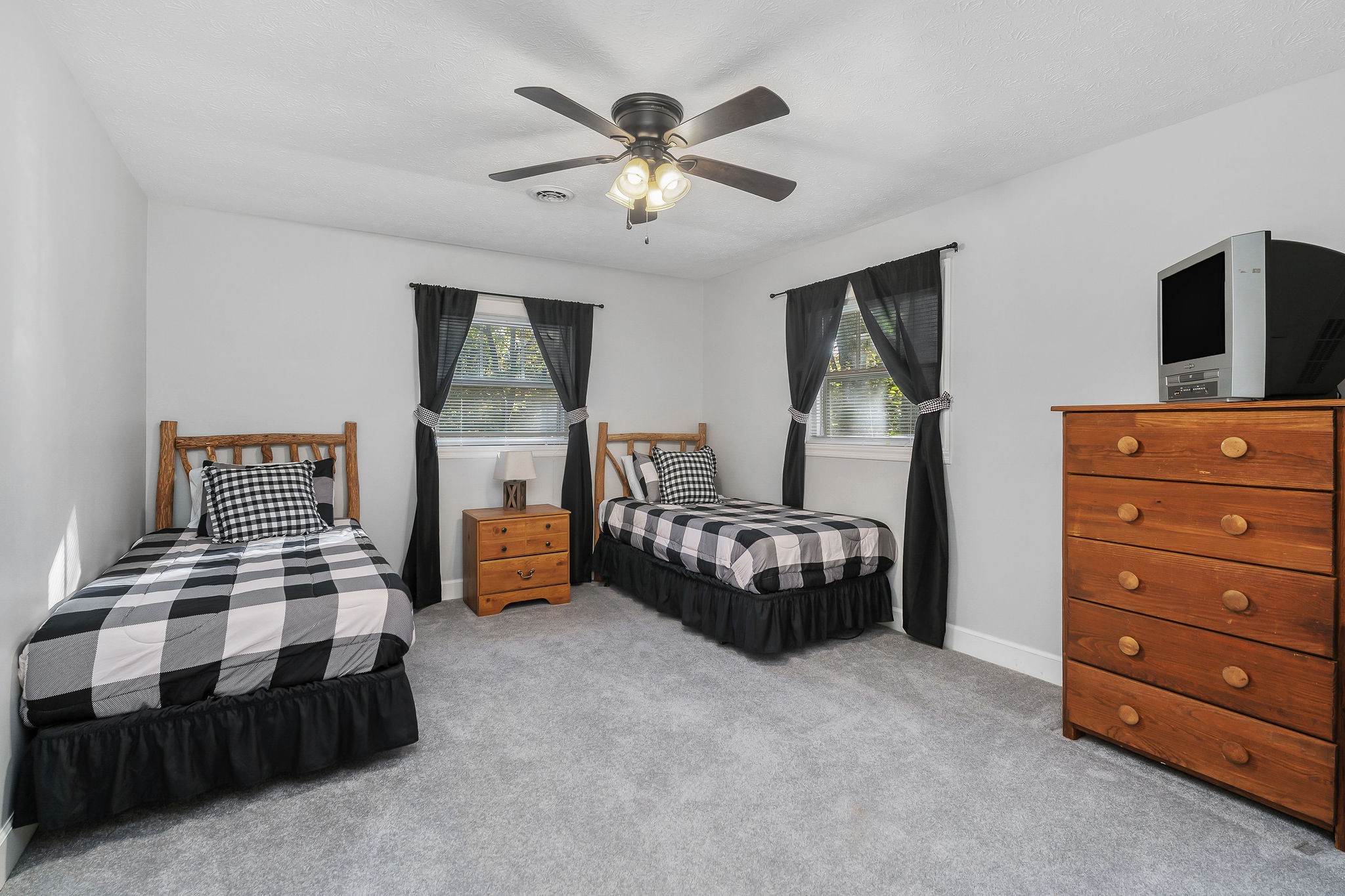 1824 Puckett Point Road Smithville, TN 37166 - Photo 44 of 53 a bedroom with a bed and a chandelier