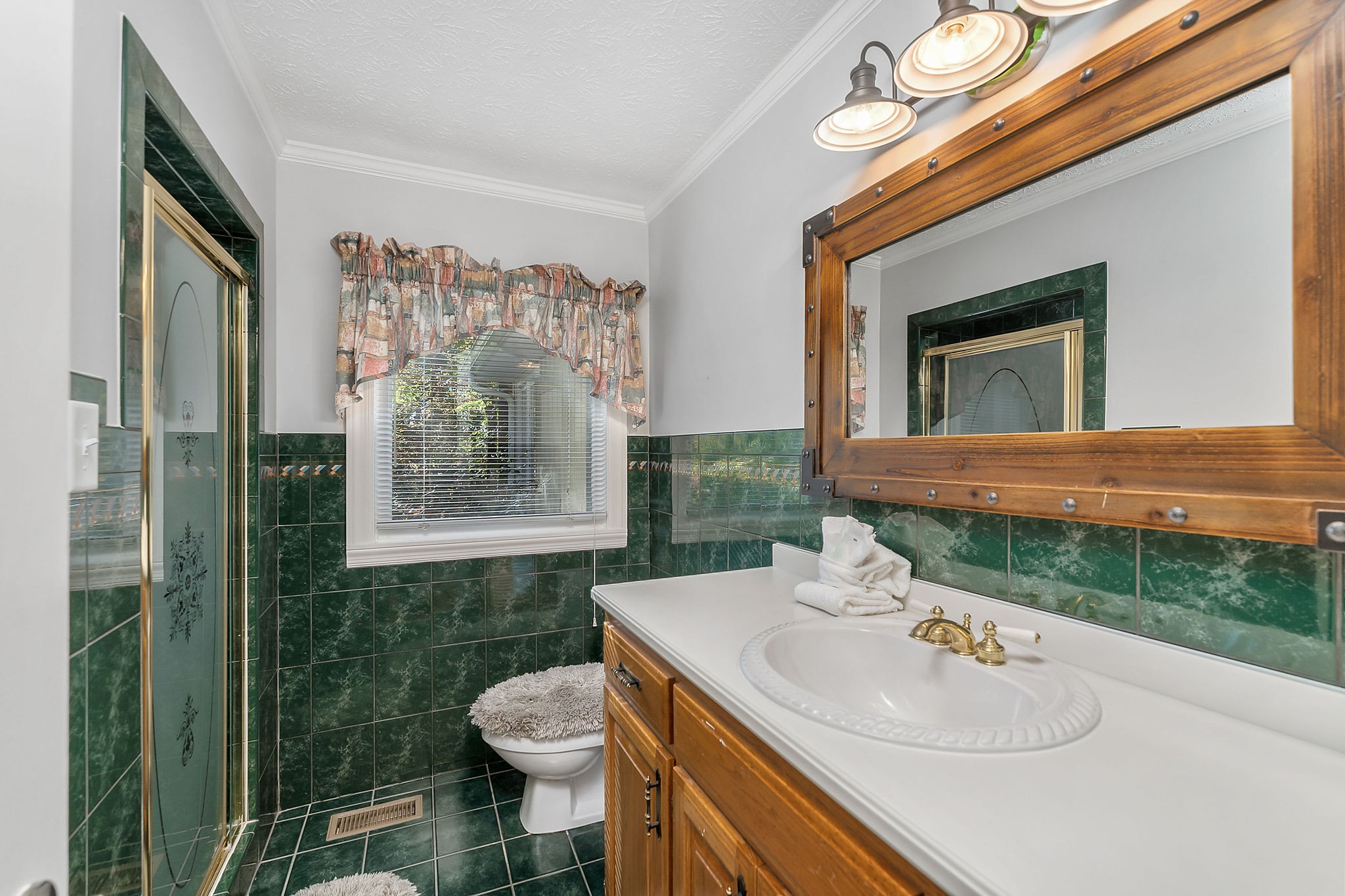 1824 Puckett Point Road Smithville, TN 37166 - Photo 45 of 53 a bathroom with a sink toilet and shower