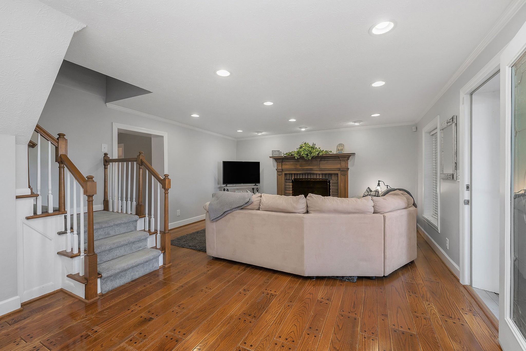 1824 Puckett Point Road Smithville, TN 37166 - Photo 5 of 53 a living room with furniture a fireplace and a flat screen tv