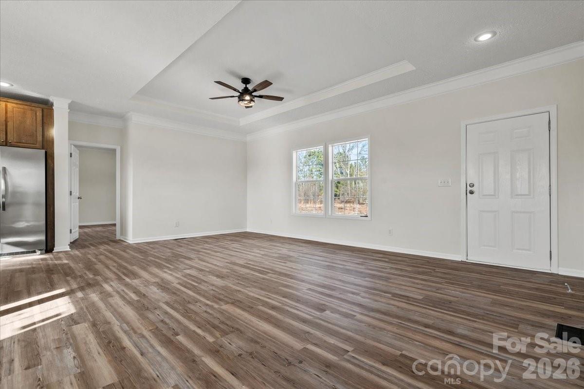 5257 Raleys Mill Road Bethune, SC 29009 - Photo 11 of 48 a view of empty room with wooden floor and fan