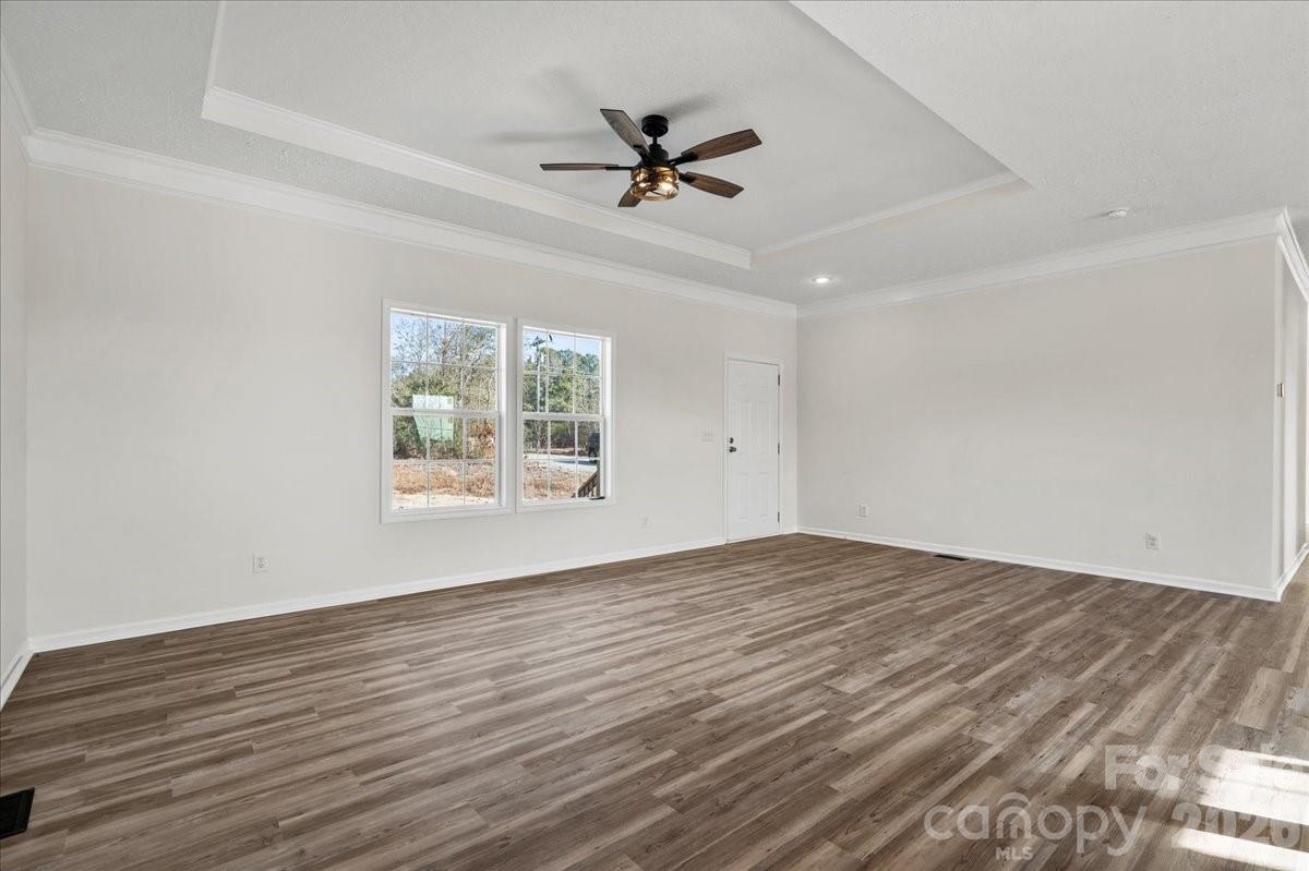 5257 Raleys Mill Road Bethune, SC 29009 - Photo 12 of 48 wooden floor in an empty room with a window