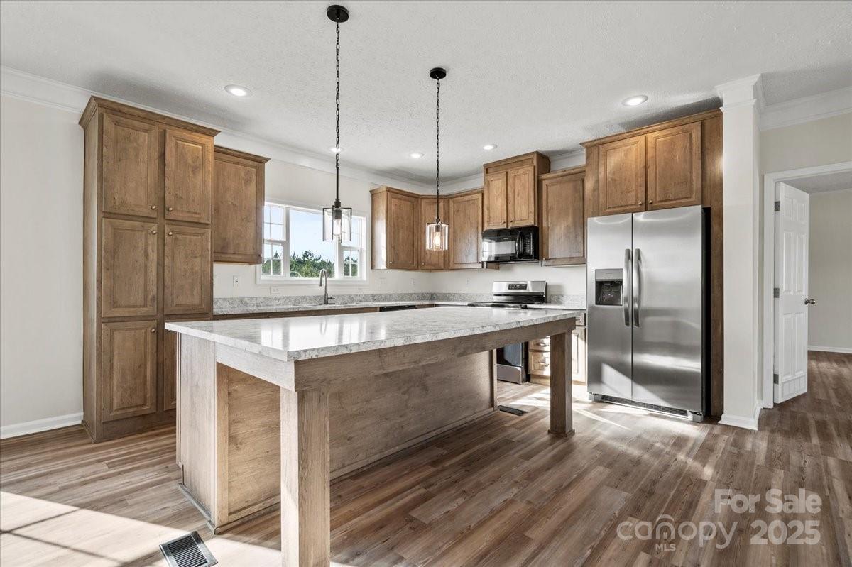 5257 Raleys Mill Road Bethune, SC 29009 - Photo 14 of 48 a kitchen with stainless steel appliances granite countertop a refrigerator a stove a sink and a refrigerator