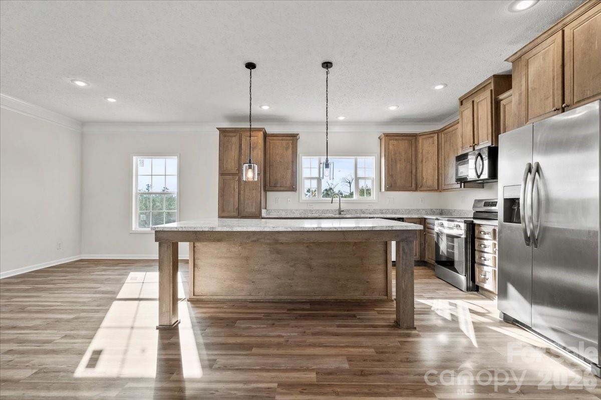 5257 Raleys Mill Road Bethune, SC 29009 - Photo 14 of 48 a kitchen with kitchen island a counter top space appliances and a cabinets