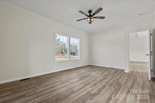 a spacious bathroom with double vanity and a bathtub