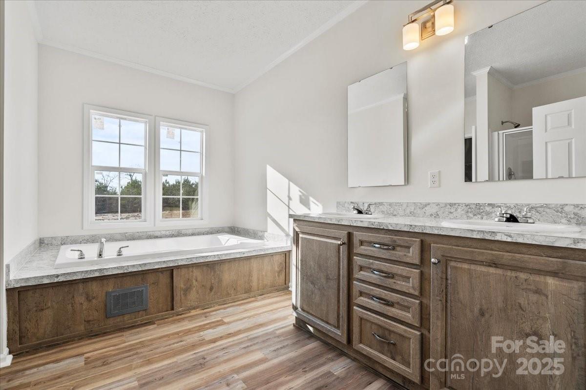 5257 Raleys Mill Road Bethune, SC 29009 - Photo 24 of 48 a spacious bathroom with double vanity and a bathtub