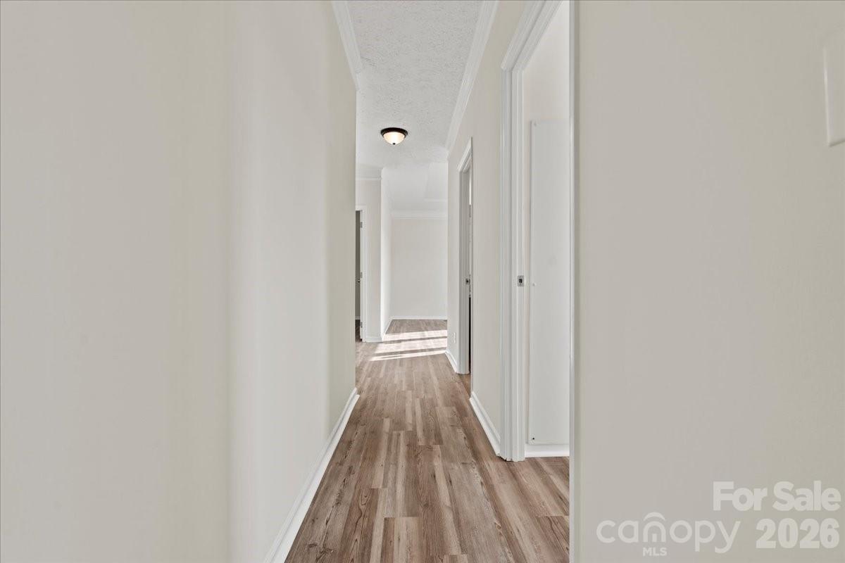 5257 Raleys Mill Road Bethune, SC 29009 - Photo 30 of 48 a view of a hallway with wooden floor