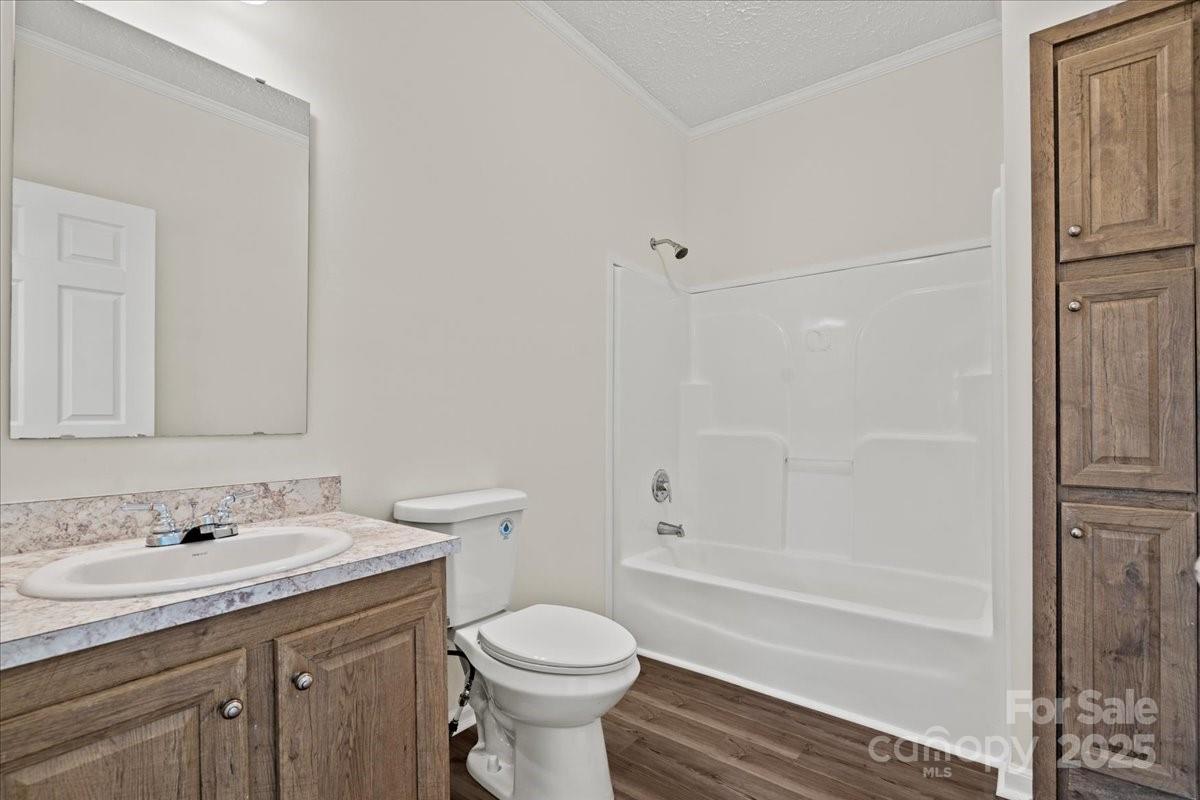 5257 Raleys Mill Road Bethune, SC 29009 - Photo 31 of 48 a bathroom with a granite countertop sink toilet and shower