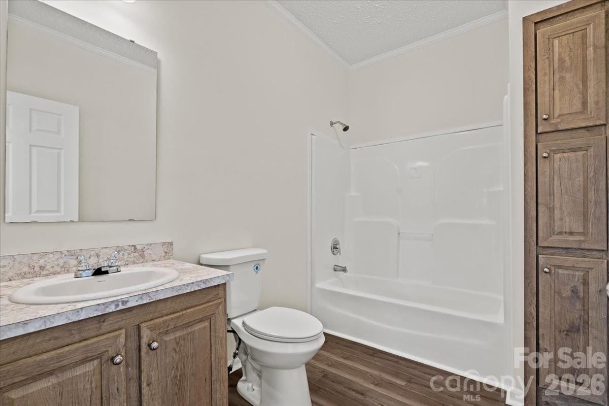 5257 Raleys Mill Road Bethune, SC 29009 - Photo 32 of 48 a bathroom with a granite countertop sink toilet and shower