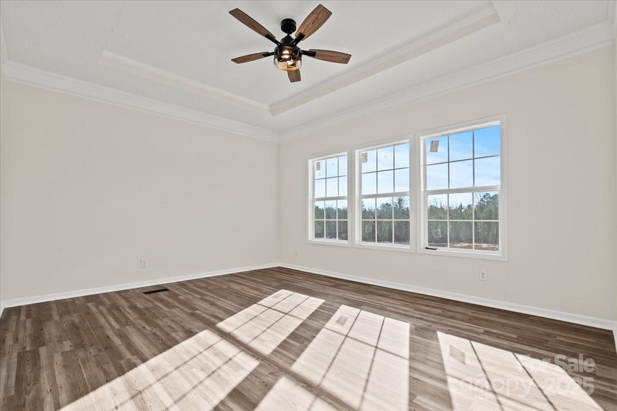 5257 Raleys Mill Road Bethune, SC 29009 - Photo 34 of 48 a view of empty room with wooden floor and fan