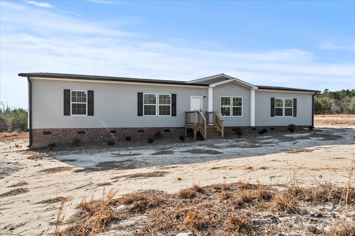 5257 Raleys Mill Road Bethune, SC 29009 - Photo 44 of 48 a view of a house with a yard