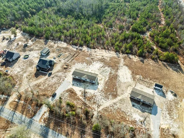 a kitchen with stainless steel appliances granite countertop a refrigerator a stove a sink and a refrigerator