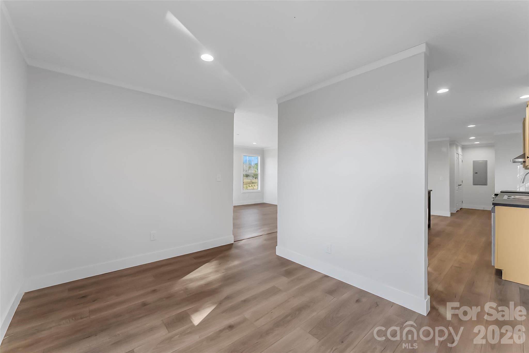 1710 Hudlow Road Forest City, NC 28043 - Photo 12 of 23 a view of a big room with wooden floor and windows