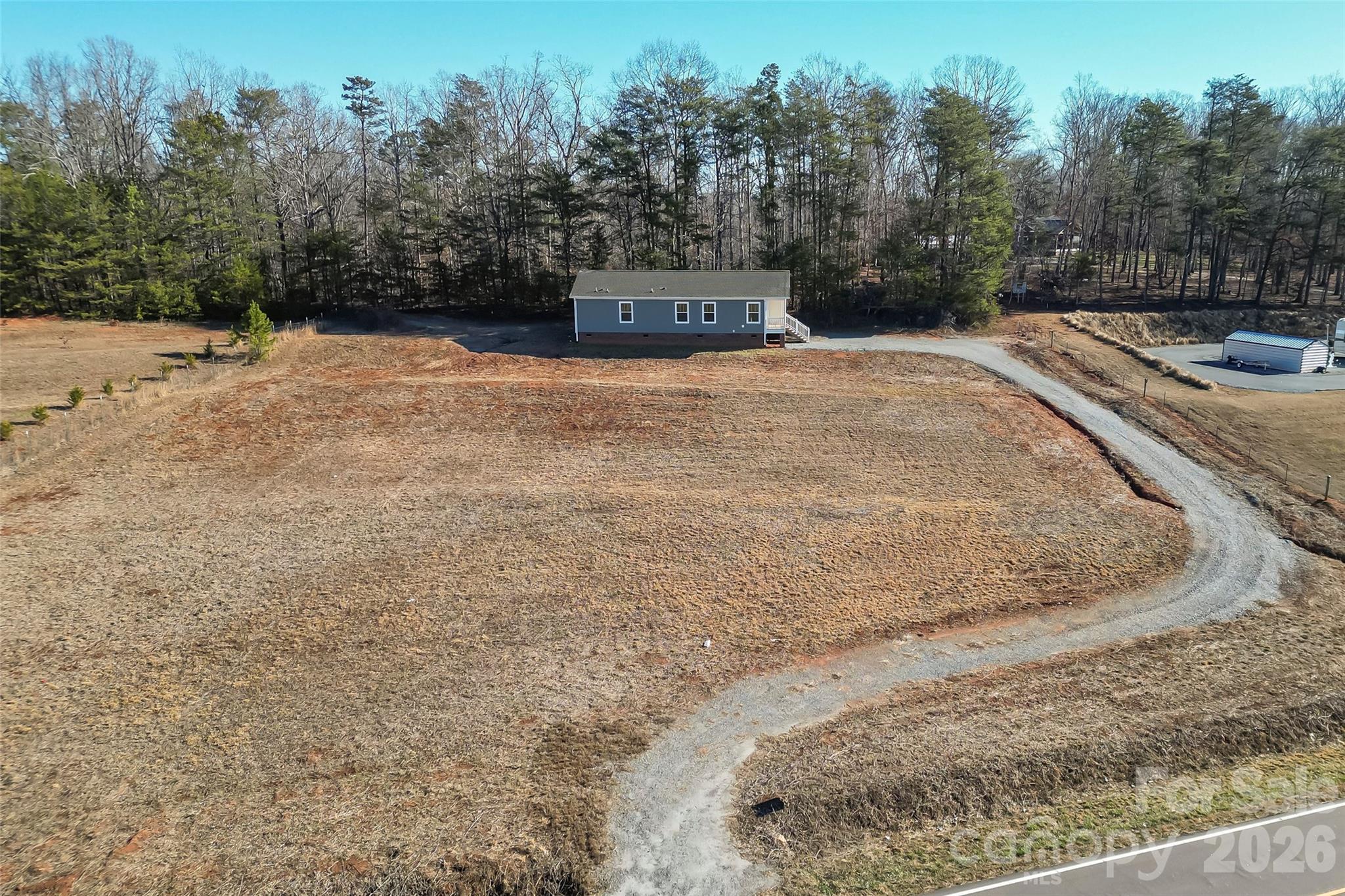1710 Hudlow Road Forest City, NC 28043 - Photo 2 of 23 a view of a dry yard with trees