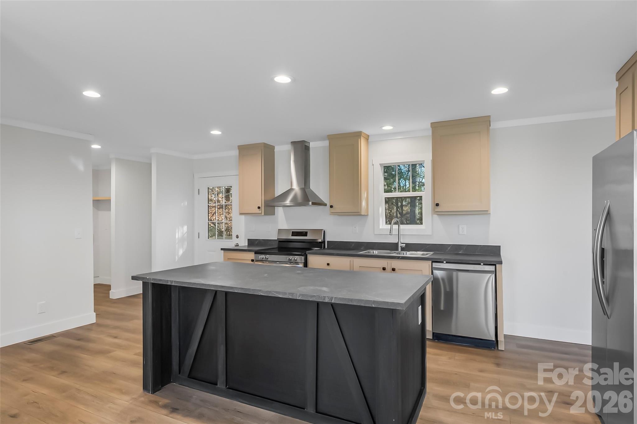 1710 Hudlow Road Forest City, NC 28043 - Photo 7 of 23 a kitchen with stainless steel appliances granite countertop a sink a stove a refrigerator and a oven