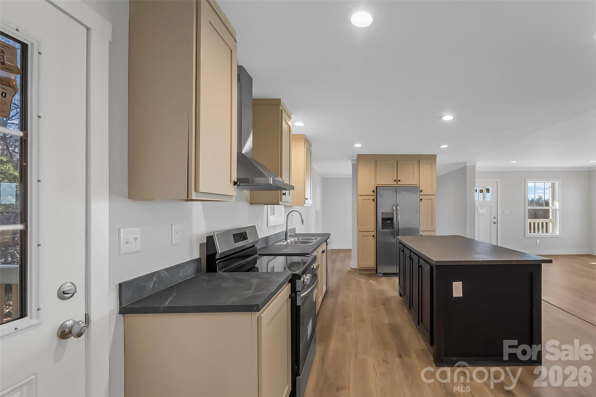 1710 Hudlow Road Forest City, NC 28043 - Photo 8 of 23 a kitchen with stainless steel appliances granite countertop a sink stove and refrigerator
