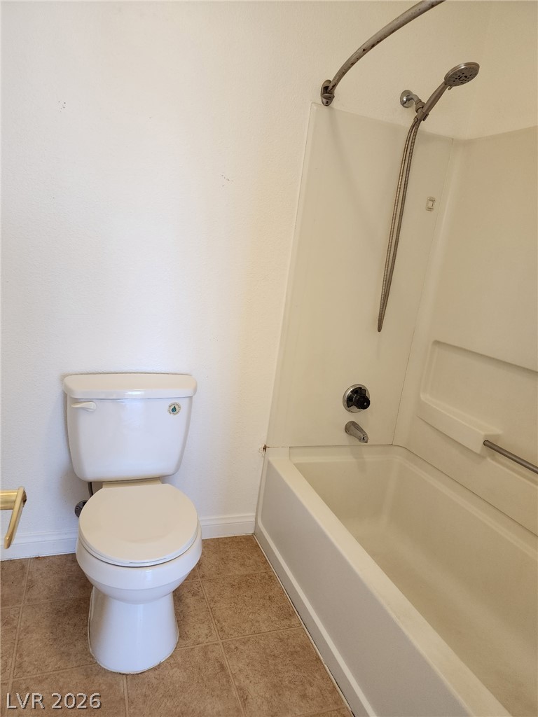 231 West Horizon Ridge Parkway, Unit 1127 Henderson, NV 89012 - Photo 24 of 39 Functional full bathroom featuring a tub-shower combination and tiled flooring.