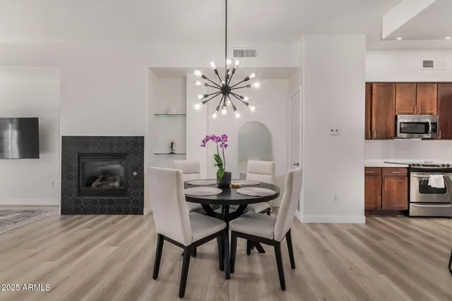 a dining room with furniture and window