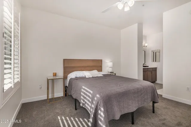 a bedroom with a bed and a cabinets