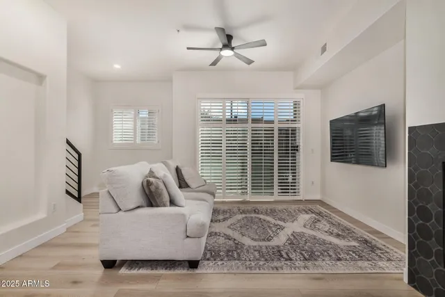 a living room with furniture and windows