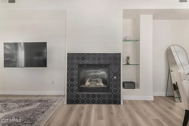 a living room with a fireplace