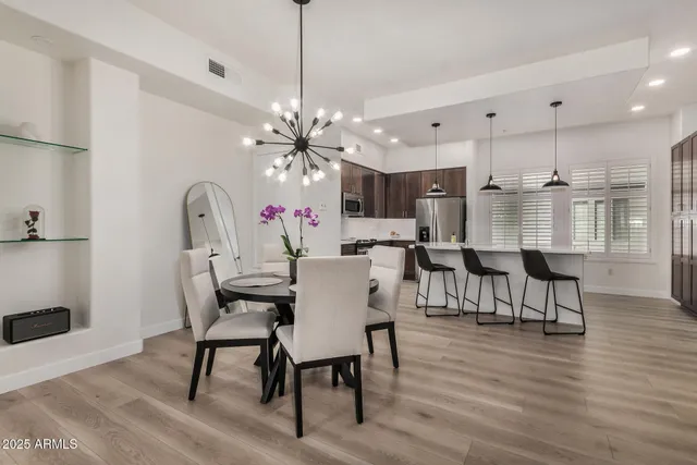 a view of a dining room with furniture window and wooden floor