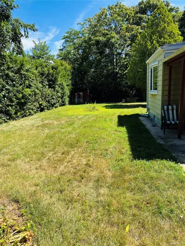 a view of a swimming pool with a yard
